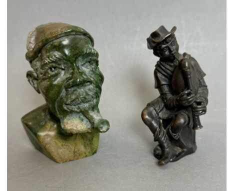 A miniature cast bronze figure of a boy playing a bagpipe - modern, dark brown patination, 8cm high; together with a small Af