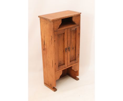 A pine wall hanging cabinet - modern, with an open shelf with shaped corner brackets over a pair of panelled doors (LWH 45 x 