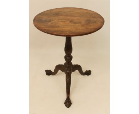 A George III mahogany tilt-top tripod table - late 18th century, the circular top supported by a reeded baluster column, to f