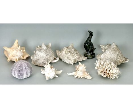 A small collection of large exotic sea shells and coral - together with an African carved green soapstone figure of a duck, s