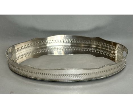 A Regency style silver plated copper galleried drinks tray - oval with barbed, gadrooned rim and two pierced end handles, 46.