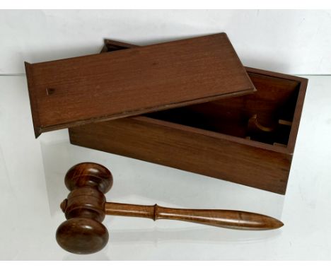 An antique mahogany cased turned fruitwood gavel - the gavel 28.5cm long, the box with sliding lid, 31.5 x 15.2 x 8.5cm.