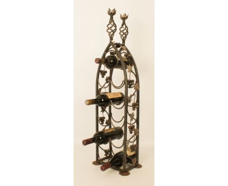 A wrought-iron eleven-bottle wine-stand holding four bottles of red wine -  Chapelle de la Trinité 1971 - Saint-Émilion; Chât