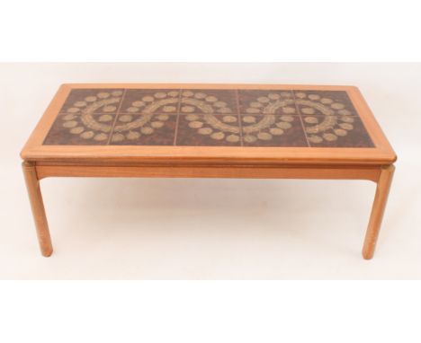 A 1970s tile-top teak coffee table by Nathan Furniture - (LWH 112 x 51 x 41 cm)