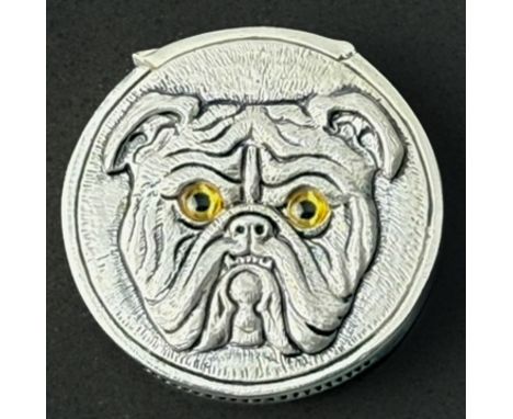 A modern .800 silver bulldog vesta case - stamped '800', counter form, each side with a bulldog's head in relief with amber g