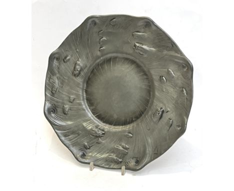 **Olof Ahlberg (Swedish, 1876-1956) for Schreuder and Olsson: an Arts & Crafts pewter charger - of octagonal form, cast decor