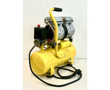 A 600w 9L oil-free mute type electric Air Compressor - 220v, fitted with a Continental type plug, not tested, appears to be i