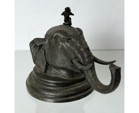 An early 20th century novelty spelter Elephant head inkwell - originally silver plated (plating now heavily worn), the finial