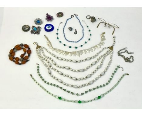 A group of silver and costume jewellery - including an Eastern amber and white metal necklace; a gilt metal micro mosaic broo