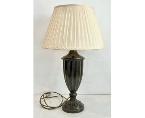 A bronzed metal fluted urn-form table lamp by Chelsom - with ivory pleated silk shade, 66.5cm high overall.