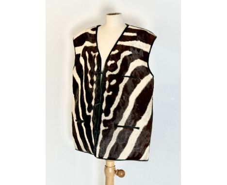 A vintage zebra skin and suede waistcoat - probably 1950s-60s, with black lining, three button closure, two waist pockets and