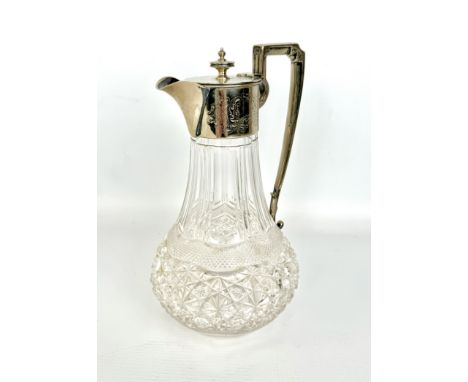 A cut-glass claret jug with silver-plated mounts, c.1910 - 26cm high.