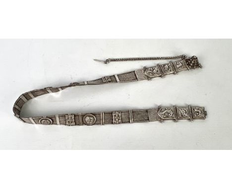 An Indian white metal Arapatti tribal belt - from the Tamil Nadu region, c.1900, the herringbone braided and barred belt set 