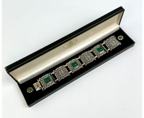 A .925 silver bracelet with matching earrings, possibly with green jade.