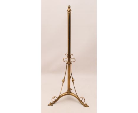 An Art Nouveau brass lamp standard - the adjustable column height 110 cm to 161 cm, on a tripod base with sinuous scrolled de