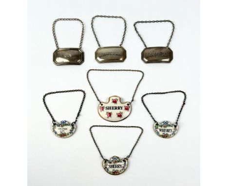 Seven silver and porcelain wine labels - comprising a pair of silver octagonal wine labels, 'Sherry' and 'Brandy', Francis Ho