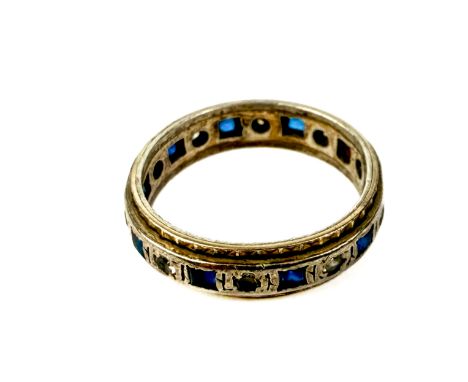 A 9ct yellow gold, silver, blue and white sapphire eternity ring - early 20th century, size M. (one stone missing, worn)