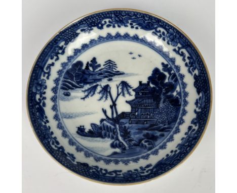 A Chinese export Qing dynasty blue and white porcelain saucer - probably Qianlong period (1735-1796), painted with a river la