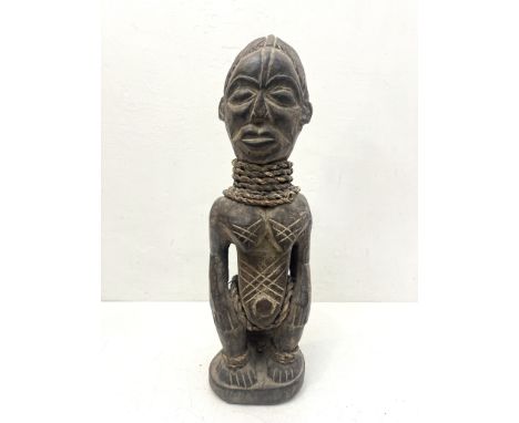 Native tribal interest: two African carvings - comprising a carved wooden female fertility figure, probably Democratic Republ