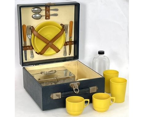 A mid-century motorist's picnic set for two - with plated forks and tea spoons; knives with amber catalin handles; yellow bak