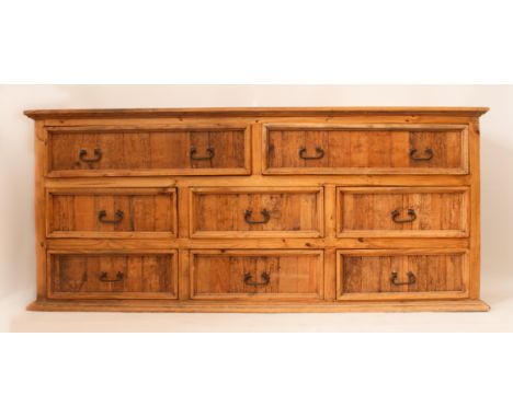 A large pine eight drawer side cabinet or dresser base - modern, with a cleated top over two upper drawers and six shorter lo