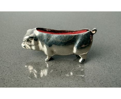 A modern sterling silver pig pincushion - Ari D Norman, London 1990, 4.6cm long, weight 27.2g.