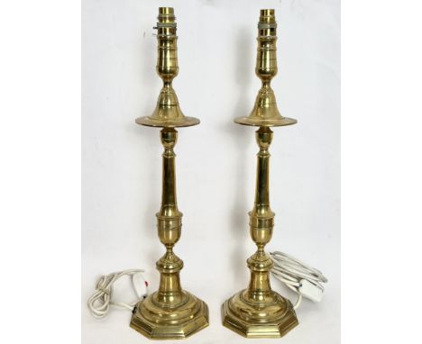 A pair of brass candlestick style table lamps - turned form with octagonal bases, 52.5cm high plus fittings (converted from e