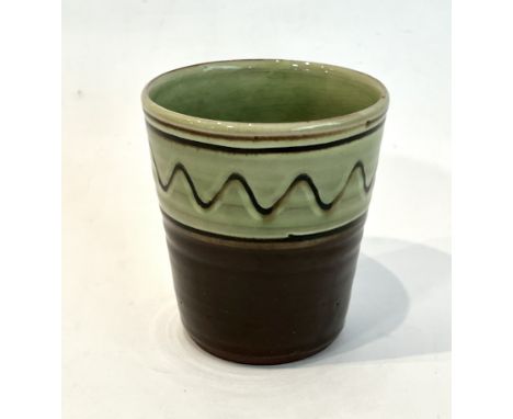 Sidney Tustin at Winchcombe Pottery: a studio pottery earthenware beaker - of slightly ribbed, tapered form, in a light green