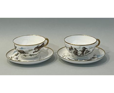 A pair of large Paris porcelain cups and saucers by Paul Blot - second half 19th century, one painted with a tortoise and har