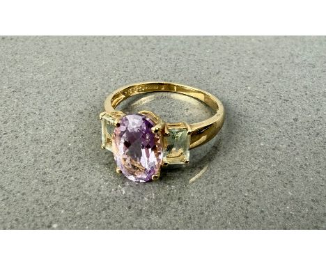 A 9ct gold ring set with amethyst and aquamarine, size S.