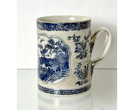 A Chinese porcelain blue and white export large tankard - 19th century, painted with a shaped reserve with a lake landscape, 