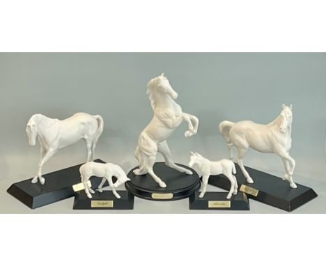 Five Beswick and Royal Doulton white matt glazed porcelain horse figures - all mounted on ebonised wooden bases, including Ro