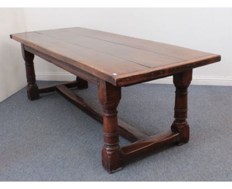 A late-17th century style oak refectory table - second half 20th century, the three plank top with cleated ends, above a moul