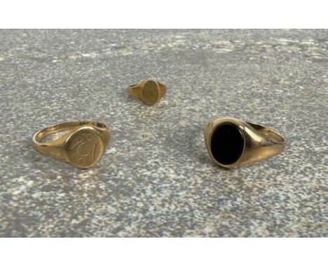 Two 9ct gold signet rings - one with indistinct hallmarks (due to sizing), with an inset onyx stone, size N; the other hallma