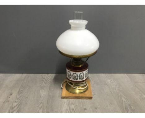 Brasss and porcelain converted oil lamp complete with glass shade