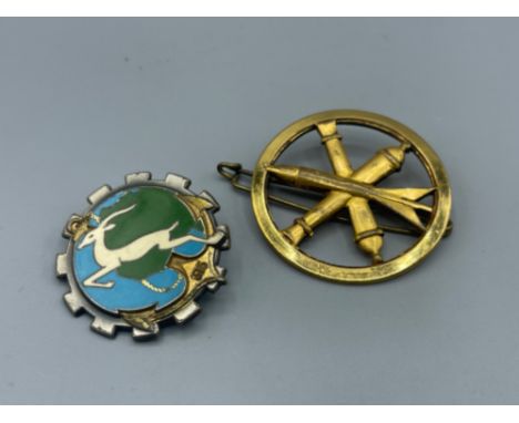 Two French related badges - A French Army Artillery Beret Badge (left) &amp; A unique 1950s Badge regarding the French transp