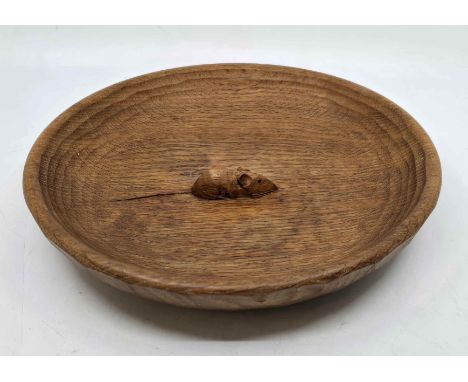 Robert 'Mouseman' Thompson (British 1876-1955) A carved English oak fruit bowl.
Of dished circular form with adzed finish, hi