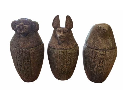 A set of Three Large Granite canopic jar garden ornaments  The v-shaped vessels are hollowed out in the middle and topped wit