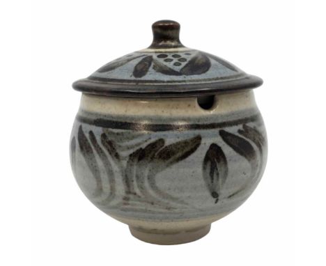 A Bernard Leach (1887-1979) Stoneware conserve / marmalade pot and cover circa 1952. Tenmoku brushwork on blue on a cream gro