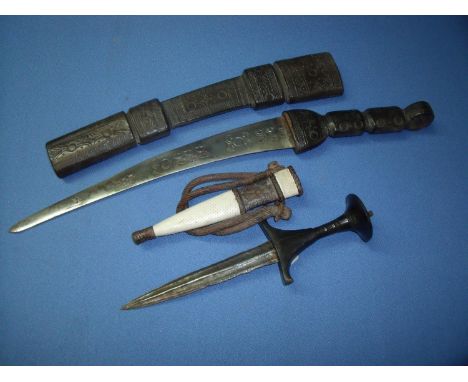 Late 19th C African arm dagger with 7 inch double edged blade &amp; turned wood grip with copper work pommel, complete with l