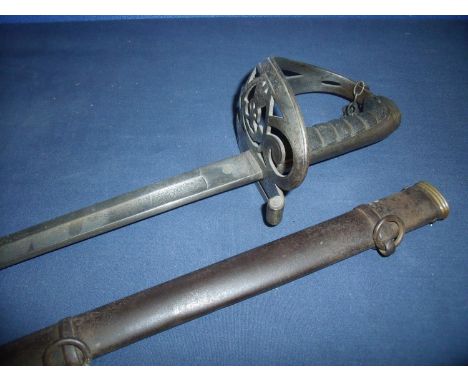 Victorian Light Infantry Officers sword with 32 1/2 inch slightly curved single part fullered blade with traces of engraved d