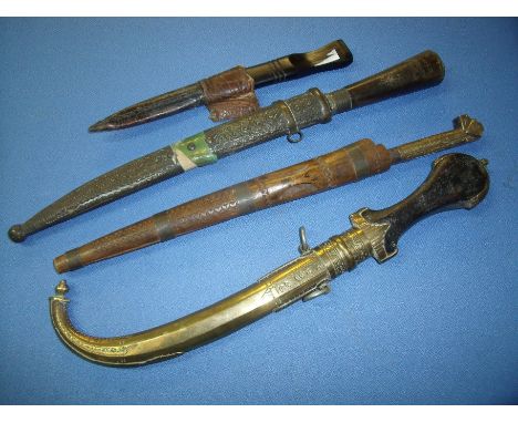 19th/20th C Indo Persian dagger with 9 inch slightly curved blade brass mounts and wooden grip, two small Khyber style knives
