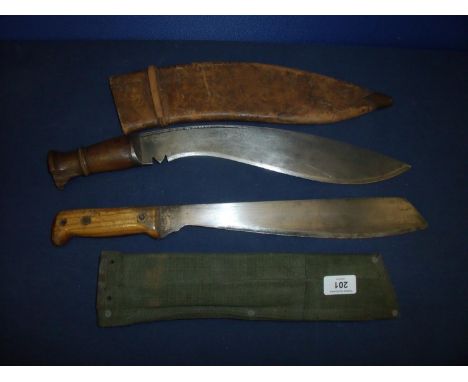 A WWI period heavy bladed Kukri knife with 14 inch blade stamped CO IGS, with broad arrow mark 1915, with ribbed wooden grip 