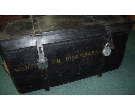 19th/20th C travelling trunk with wicker work interior with boarded wooden lid, canvas bound with heavy wrought metal straps 