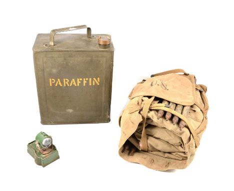 An Astra model of a search light, boxed; a Britains model of a field gun; an American Indianapolis Tent and Awning Co 1942 ca