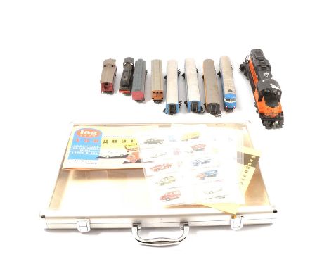 A Lionel Corporation engine, other coaches etc.Condition report:The Lionel O gauge loco is the Milwauke Road, showing some li