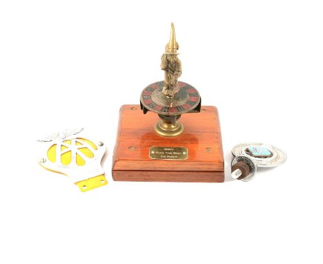 'Witch and roulette wheel’ car mascot; together with a vintage RAC and AA badge.Qty: 3Condition report:There is no head to th