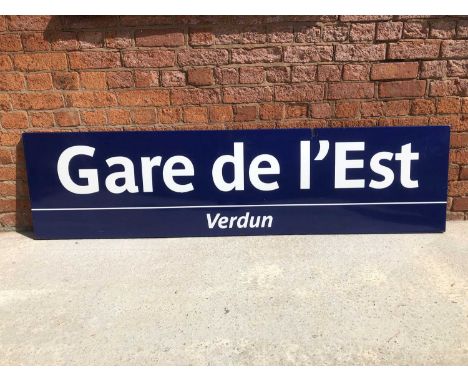 Large original French railway station enamel sign 'Gare de L'Est - Verdun', blue ground, white text, flanged edge, 53cm by 20