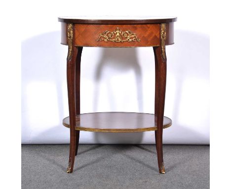 French mahogany occasional table, oval, the top with parquetry inlay, frieze drawer, cabriole legs joined by a shelf, gilt me