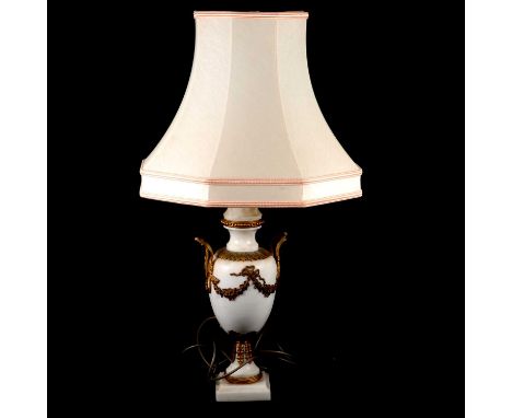 Onyx table lamp, urn form, gilt ormolu handles and ribbons and swags, square base, silk shade, overall height 66cm.